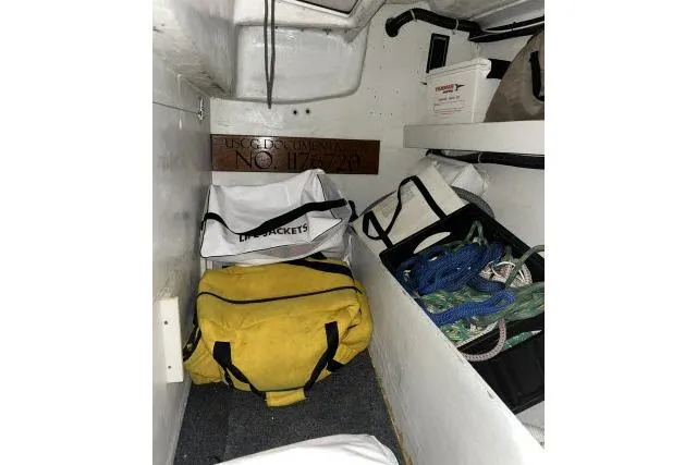 Slide: The Image of Storage area in 2004 J Boats J/133 with bags and ropes. - 23