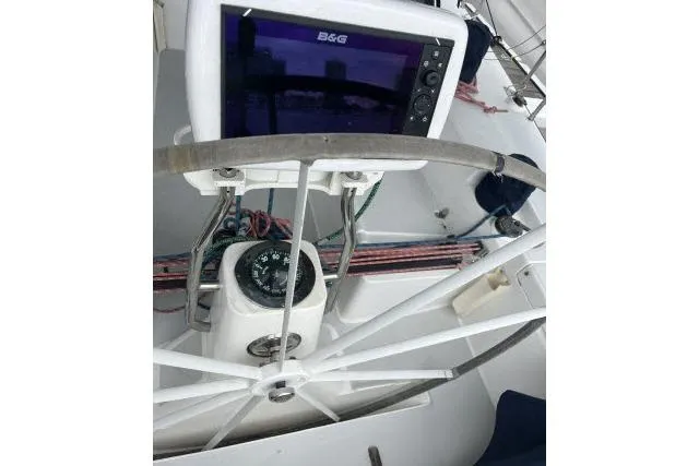 Slide: The Image of 2004 J Boats J/133 yacht cockpit with steering wheel and navigation equipment. - 25