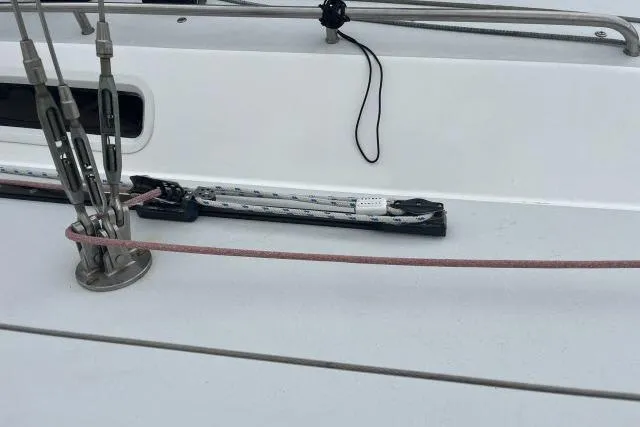 Slide: The Image of Deck details of a 2004 J Boats J/133 sailboat, featuring rigging and hardware. - 33