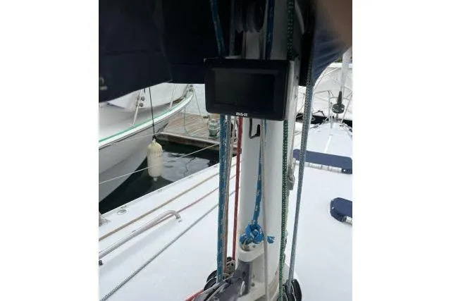 Slide: The Image of 2004 J Boats J/133 sailboat deck with ropes and navigation equipment. - 35