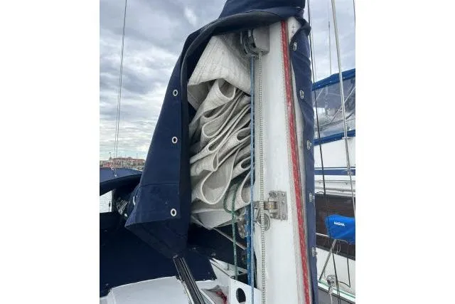 Slide: The Image of 2004 J Boats J/133 sailboat with neatly folded sails and protective cover. - 36