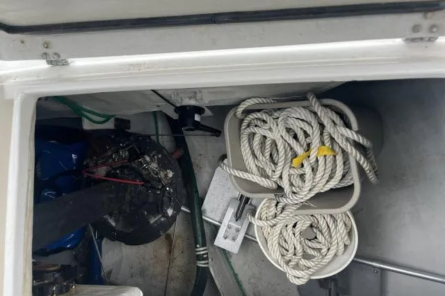 Slide: The Image of Storage compartment of a 2004 J Boats J/133 with ropes and equipment. - 37
