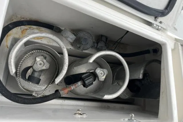 Slide: The Image of Storage compartment with gas cylinders on a 2004 J Boats J/133 sailboat. - 39