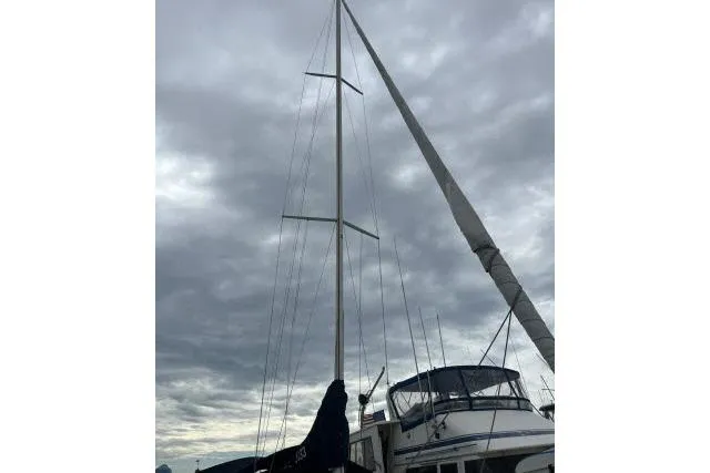Slide: The Image of Sailboat mast of 2004 J Boats J/133 under cloudy sky. - 43