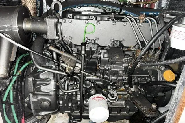 Slide: The Image of Engine of a 2004 J Boats J/133 sailboat, featuring Yanmar components and intricate wiring. - 48