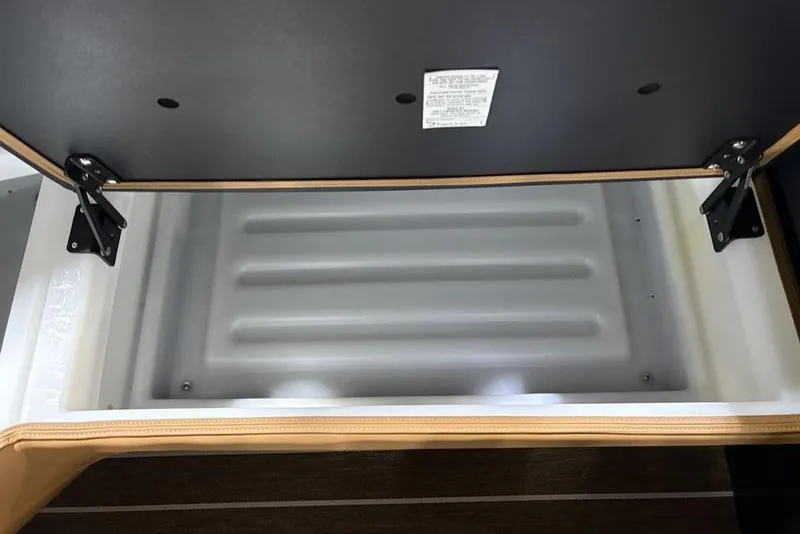 Slide: The Image of Open storage compartment in 2026 Premier 230 Sunsation RL boat. - 12