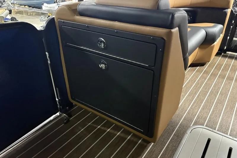 Slide: The Image of 2026 Premier 230 Sunsation RL boat interior with sleek seating and storage compartments. - 17