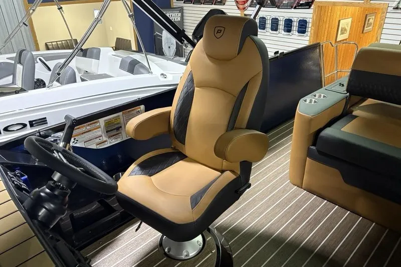 Slide: The Image of Luxurious interior of 2026 Premier 230 Sunsation RL boat with plush captain's chair. - 23