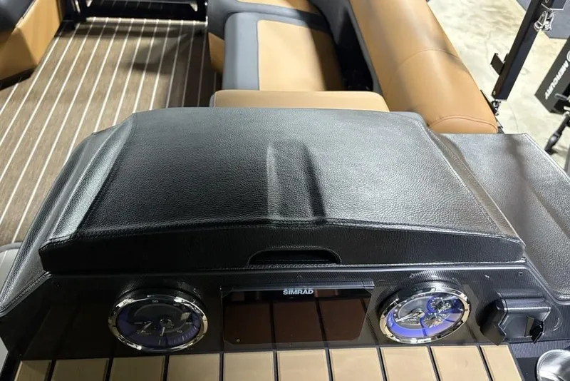 Slide: The Image of Dashboard of 2026 Premier 230 Sunsation RL boat with leather cover and gauges. - 24