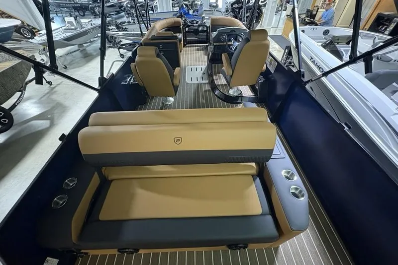 Slide: The Image of 2026 Premier 230 Sunsation RL pontoon boat interior with tan seating and modern design. - 34