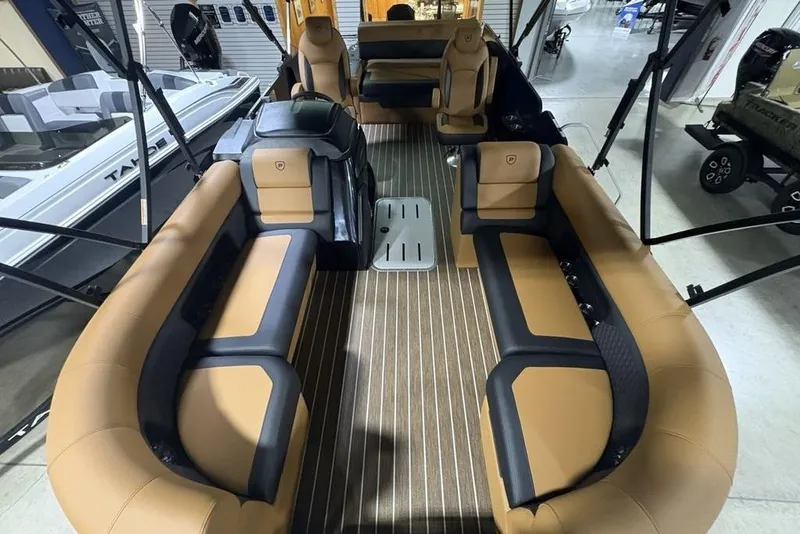 Slide: The Image of 2026 Premier 230 Sunsation RL pontoon boat interior with tan and black seating. - 35