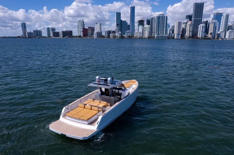 Slide: The Image of 2023 Pardo Yachts 43 cruising near a city skyline on a sunny day. - 13