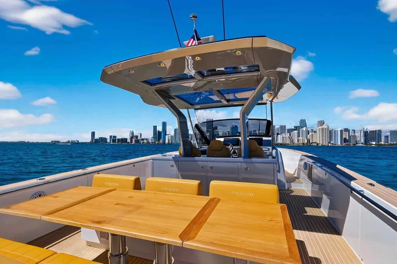 Slide: The Image of 2023 Pardo Yachts 43 cruising with city skyline in the background. - 15