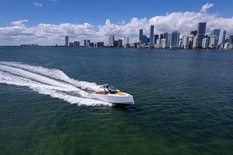 Slide: The Image of 2023 Pardo Yachts 43 cruising near city skyline on a sunny day. - 2