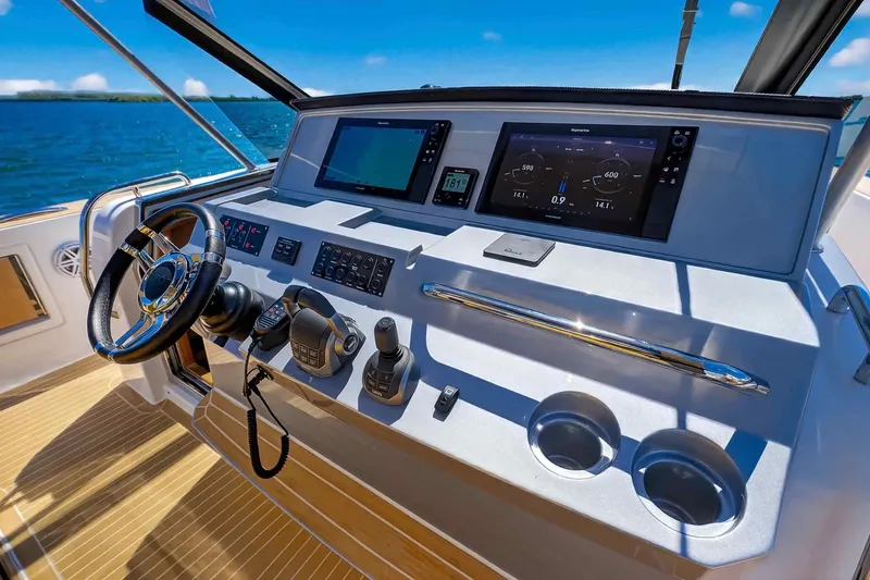Slide: The Image of Helm of 2023 Pardo Yachts 43, featuring modern navigation and control systems. - 26
