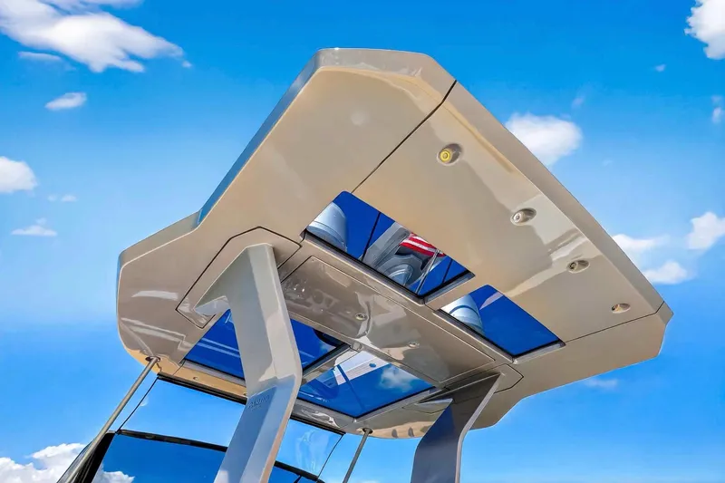 Slide: The Image of 2023 Pardo Yachts 43 hardtop against a bright blue sky. - 29