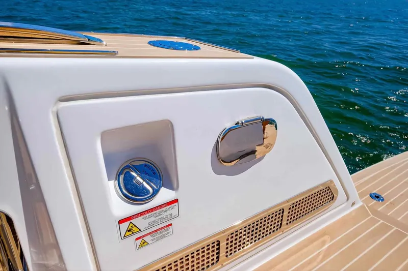 Slide: The Image of 2023 Pardo Yachts 43 deck detail with water access and safety warnings. - 32