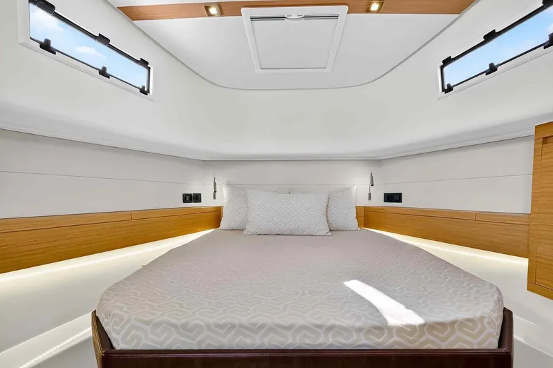 Slide: The Image of Luxurious cabin interior of 2023 Pardo Yachts 43, featuring elegant bedding and modern design. - 39