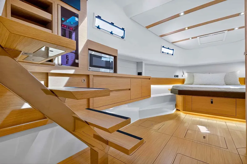 Slide: The Image of Luxurious interior of 2023 Pardo Yachts 43, featuring modern wood finishes and cozy sleeping area. - 46