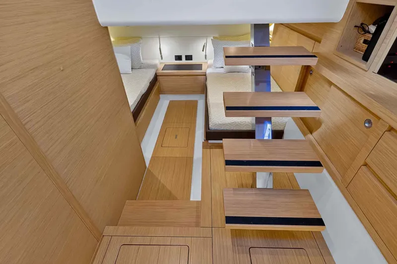 Slide: The Image of Luxurious interior of 2023 Pardo Yachts 43, featuring modern wooden design and twin beds. - 48
