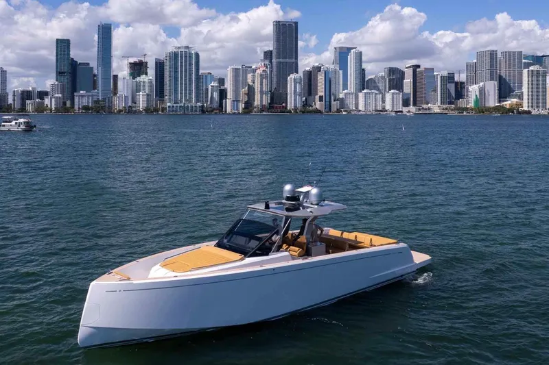 Slide: The Image of 2023 Pardo Yachts 43 cruising near a city skyline on a sunny day. - 5