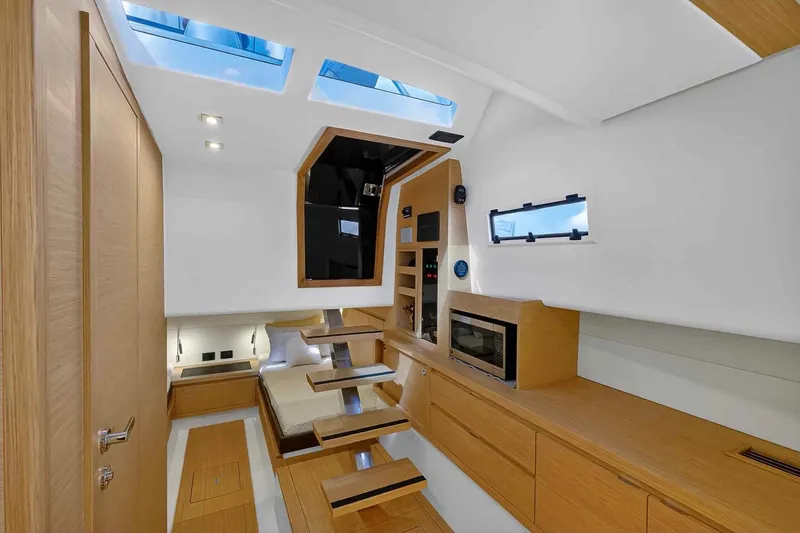 Slide: The Image of Luxurious interior of 2023 Pardo Yachts 43, featuring modern wood finishes and skylights. - 51