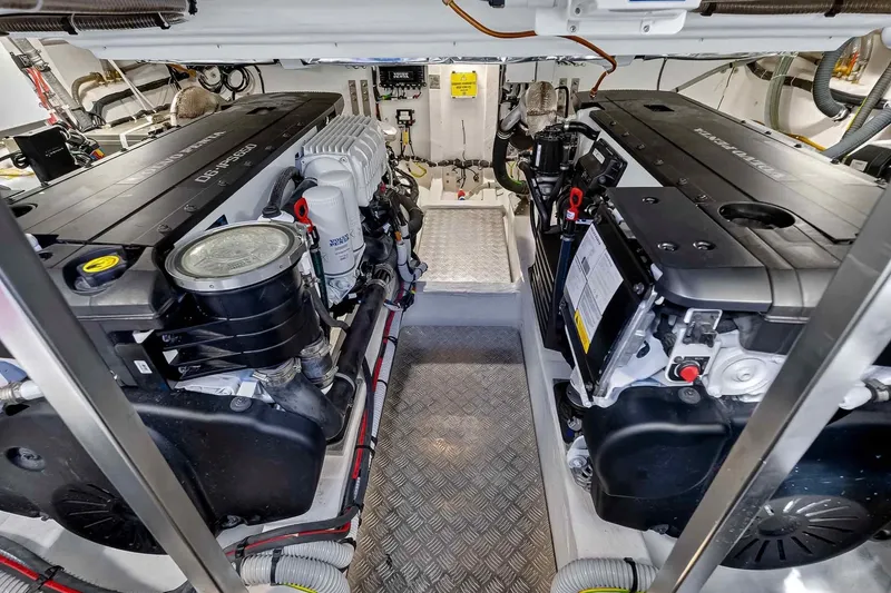 Slide: The Image of Engine room of 2023 Pardo Yachts 43, showcasing dual inboard engines and mechanical systems. - 54