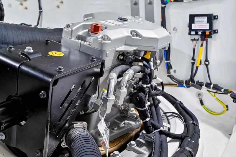 Slide: The Image of Engine compartment of 2023 Pardo Yachts 43, showcasing intricate wiring and components. - 59