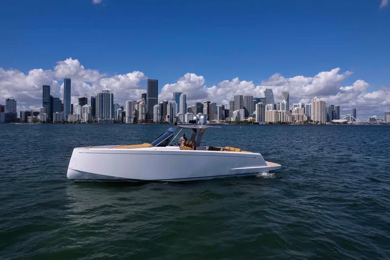 Slide: The Image of 2023 Pardo Yachts 43 cruising near a city skyline under a clear blue sky. - 6