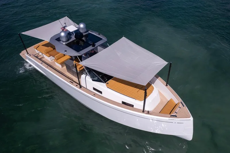 Slide: The Image of 2023 Pardo Yachts 43 cruising on clear water, featuring sleek design and sunshade. - 66