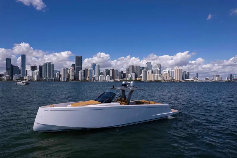 Slide: The Image of 2023 Pardo Yachts 43 cruising near a city skyline under a clear blue sky. - 7