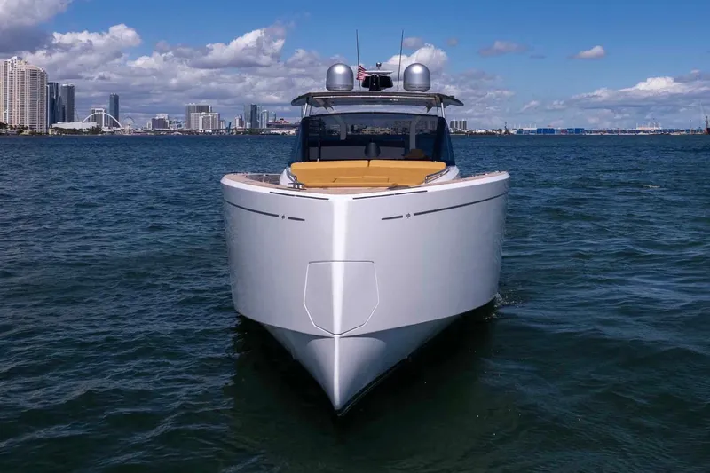 Slide: The Image of 2023 Pardo Yachts 43 cruising in a scenic coastal city backdrop. - 8