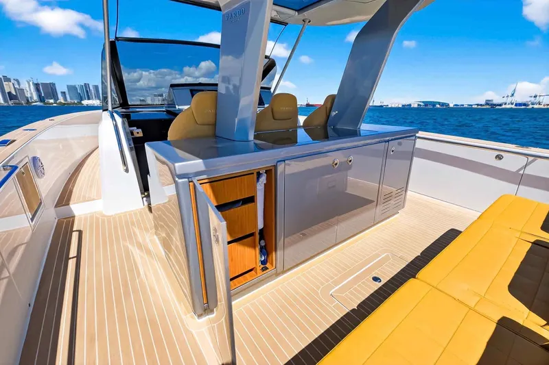 Slide: The Image of Luxurious 2023 Pardo Yachts 43 with sleek deck and modern seating, city skyline backdrop. - 20