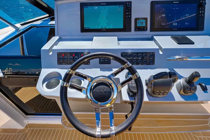 Slide: The Image of Steering console of 2023 Pardo Yachts 43 with modern navigation displays. - 25