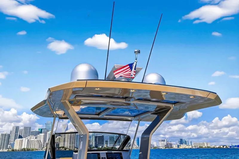 Slide: The Image of 2023 Pardo Yachts 43 with city skyline and American flag in background. - 28