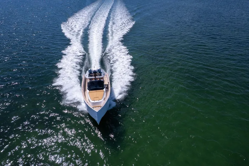 Slide: The Image of 2023 Pardo Yachts 43 cruising on open water, leaving a wake behind. - 3