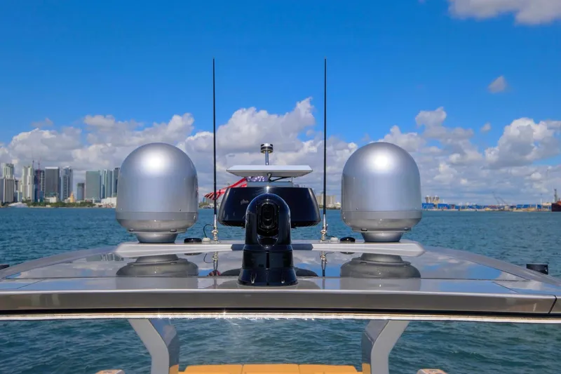 Slide: The Image of 2023 Pardo Yachts 43 with advanced navigation equipment, city skyline in background. - 31