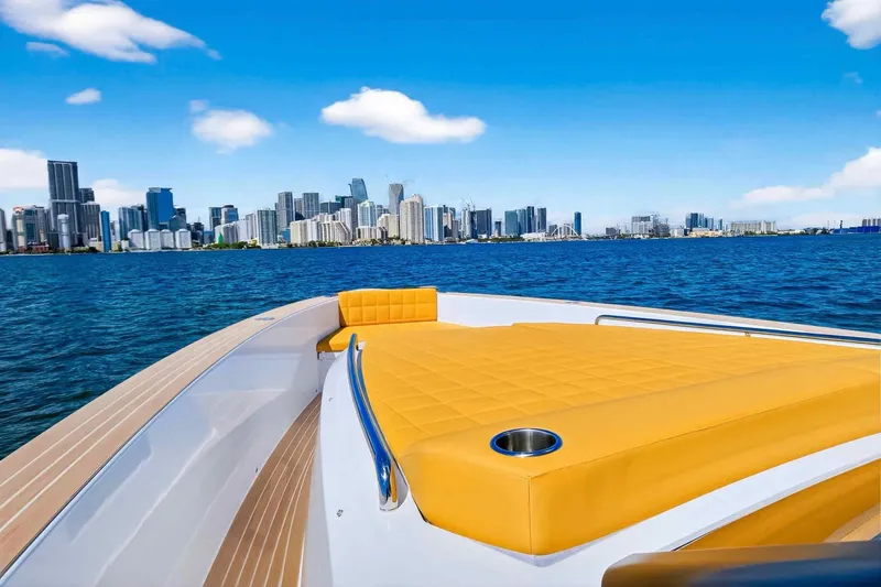 Slide: The Image of 2023 Pardo Yachts 43 with yellow deck, city skyline in background. - 36