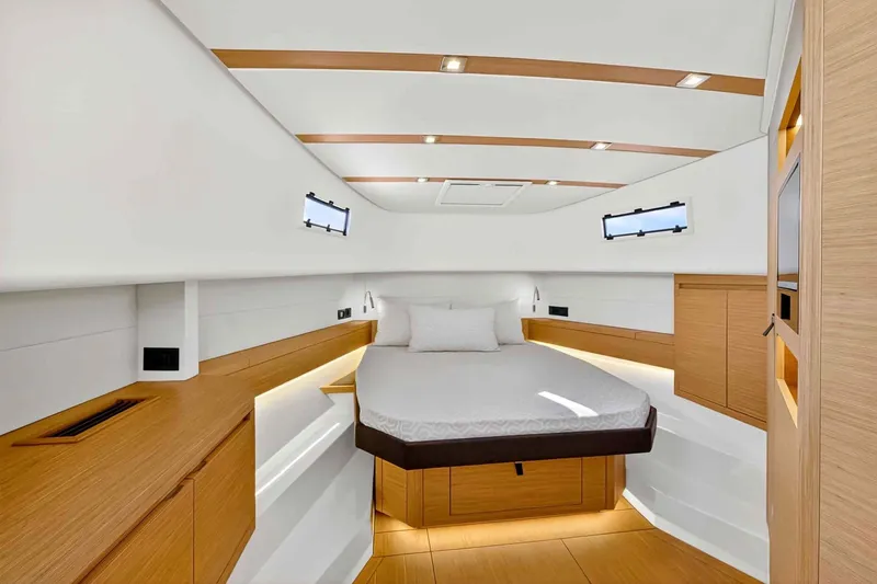 Slide: The Image of Luxurious cabin interior of 2023 Pardo Yachts 43, featuring modern wood accents and ambient lighting. - 38