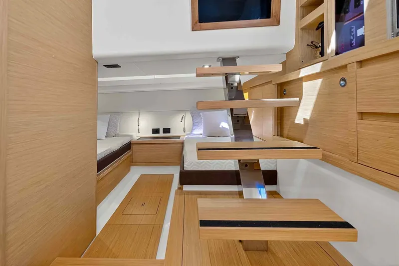Slide: The Image of Modern interior of 2023 Pardo Yachts 43, featuring sleek wooden design and cozy sleeping area. - 43