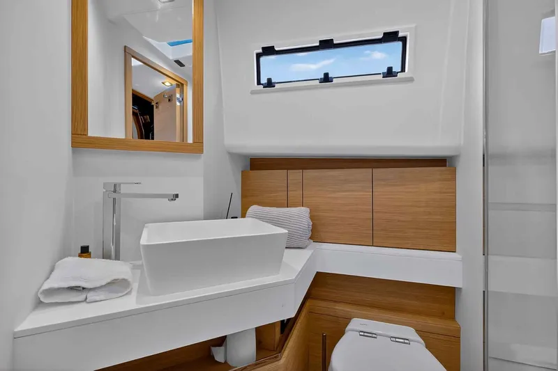 Slide: The Image of Luxurious bathroom interior of 2023 Pardo Yachts 43, featuring modern sink and wooden accents. - 49