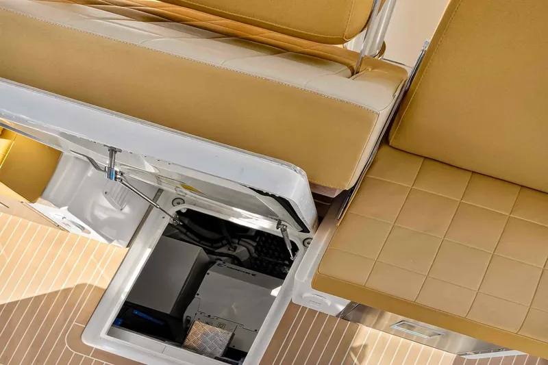 Slide: The Image of 2023 Pardo Yachts 43 interior with open storage compartment and tan seating. - 53