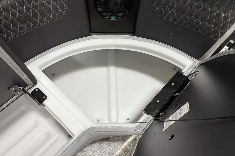 Slide: The Image of 2026 Premier 230 Solaris RF boat storage compartment with quilted upholstery and sleek design. - 12