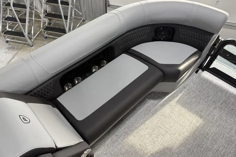 Slide: The Image of Luxurious seating on 2026 Premier 230 Solaris RF boat, featuring sleek design and cup holders. - 13