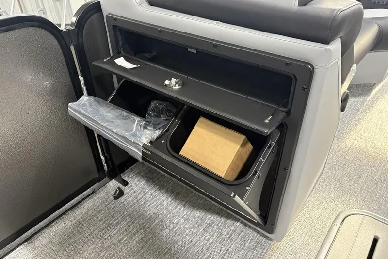 Slide: The Image of Open storage compartment in 2026 Premier 230 Solaris RF boat interior. - 20