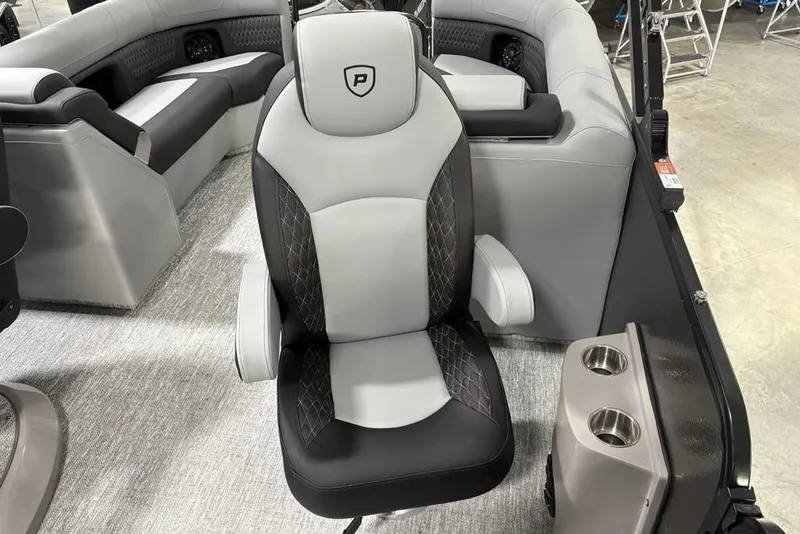 Slide: The Image of 2026 Premier 230 Solaris RF boat interior with luxurious seating and cup holders. - 25