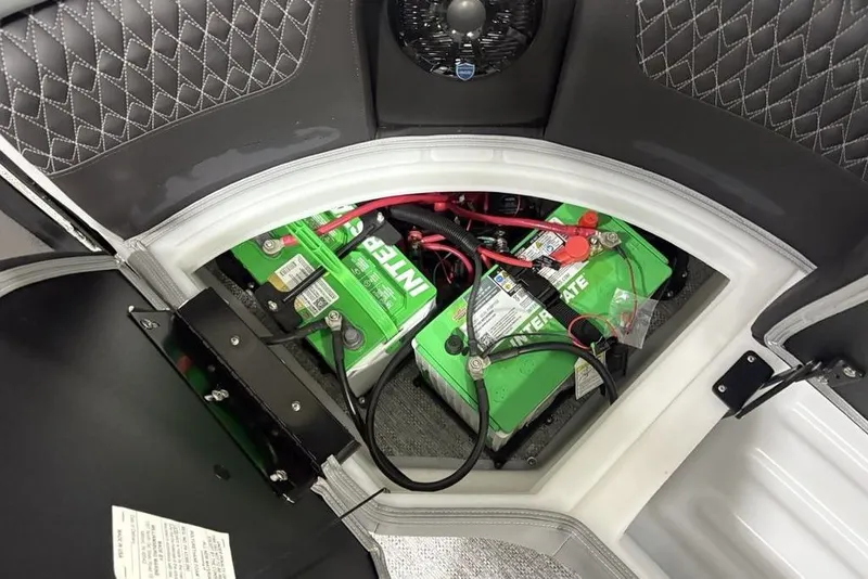 Slide: The Image of Battery compartment of 2026 Premier 230 Solaris RF boat, featuring Interstate batteries. - 30