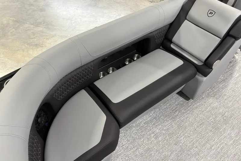 Slide: The Image of 2026 Premier 230 Solaris RF boat interior with sleek gray and black seating design. - 34