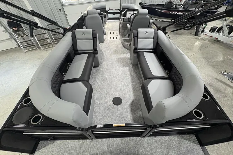 Slide: The Image of 2026 Premier 230 Solaris RF pontoon boat interior with gray seating and modern design. - 38