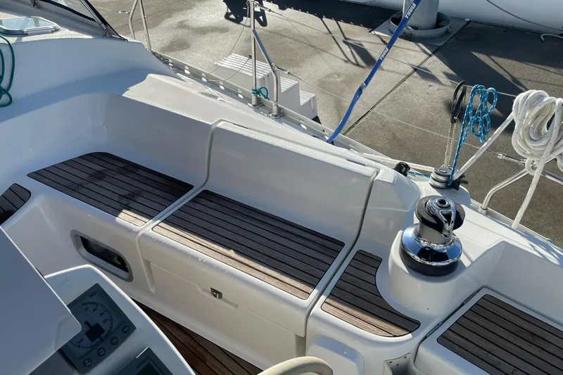 Slide: The Image of Cockpit of 2003 Jeanneau Sun Odyssey 43 DS with teak seating and winch. - 11